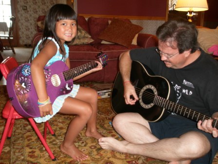 Kasen and Daddy playing guitar
